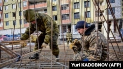 Орусия. Курулушта иштеген мигранттар. Иллюстрация үчүн колдонулган сүрөт
