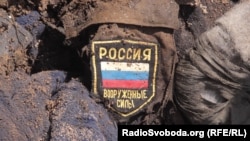 Архівна світлина. Останки одного з двох військових, знайдених місією «Евакуація 200» поблизу селища Кримського у Луганській області, 10 червня 2016 року