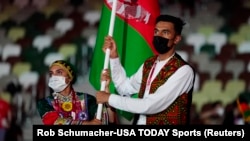 Afghan athletes march into the stadium during the opening ceremony for the Tokyo 2020 Olympic Summer Games in July.