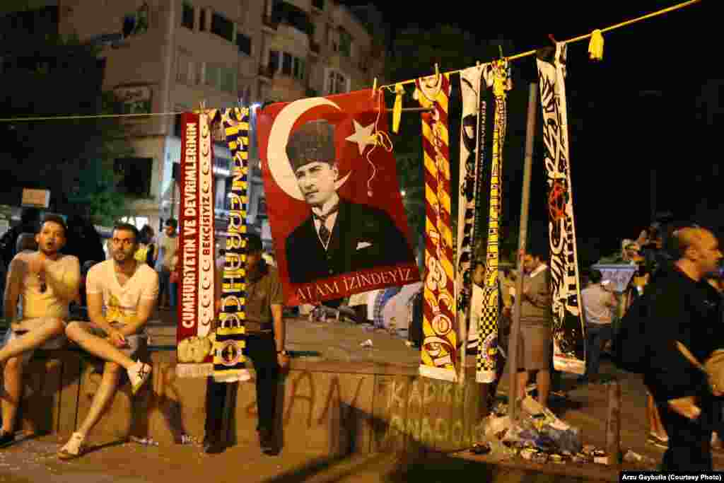 Scarves of Turkey’s football teams surround a flag with the image of Mustafa Kemal Ataturk, the founder of modern Turkey.