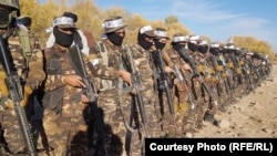 Armed Taliban soldiers attend a training session in Uruzgan Province on December 3.